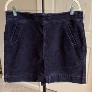 Navy corduroy mini skirt with pockets.